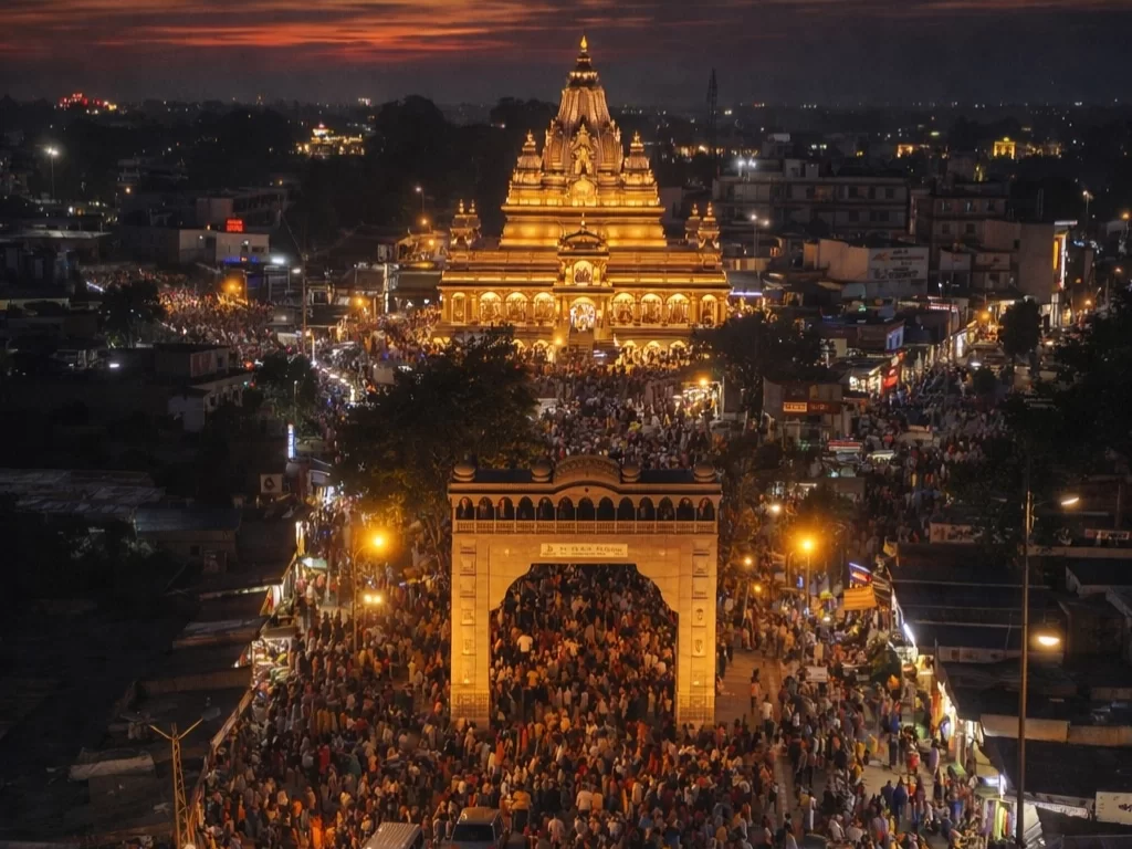 Shree Khatushyam Temple illuminated evening view with devotees crowd during festival in Rajasthan tour packages.