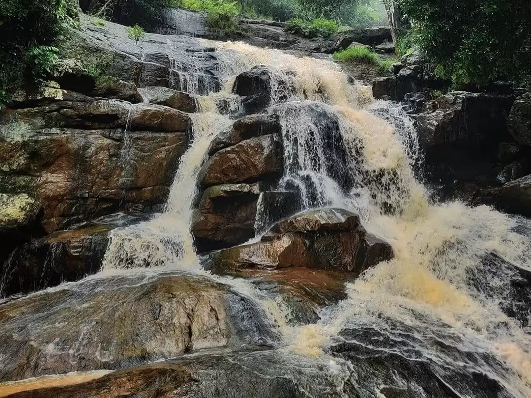 Kothapalli Waterfall scenic cascading falls amid lush greenery in Andhra Pradesh tour packages.