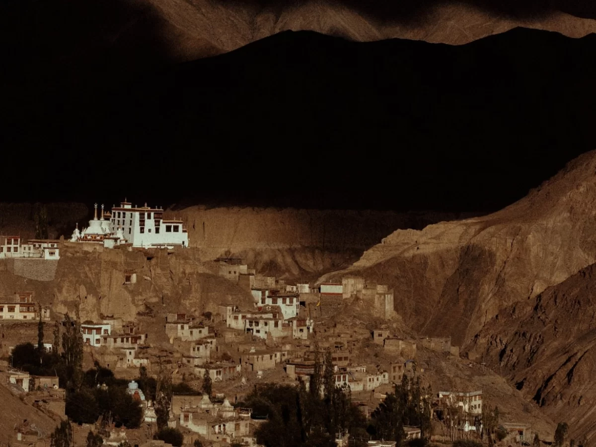 Lamayuru Moonland Ladakh dramatic evening view of Lamayuru Monastery and village nestled in rugged moonlike mountains, serene Himalayan landscape on Leh–Kargil highway for Ladakh tour packages