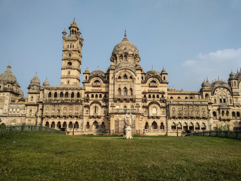 Laxmi Vilas Palace Vadodara grand Indo-Saracenic facade with domes towers and manicured lawns, royal heritage perfect for Gujarat tour packages.
