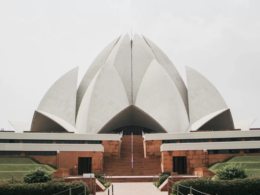 Lotus Temple, New Delhi – iconic Bahá’í House of Worship with white marble lotus petals and landscaped gardens, serene spiritual landmark featured in Delhi city sightseeing tour packages.