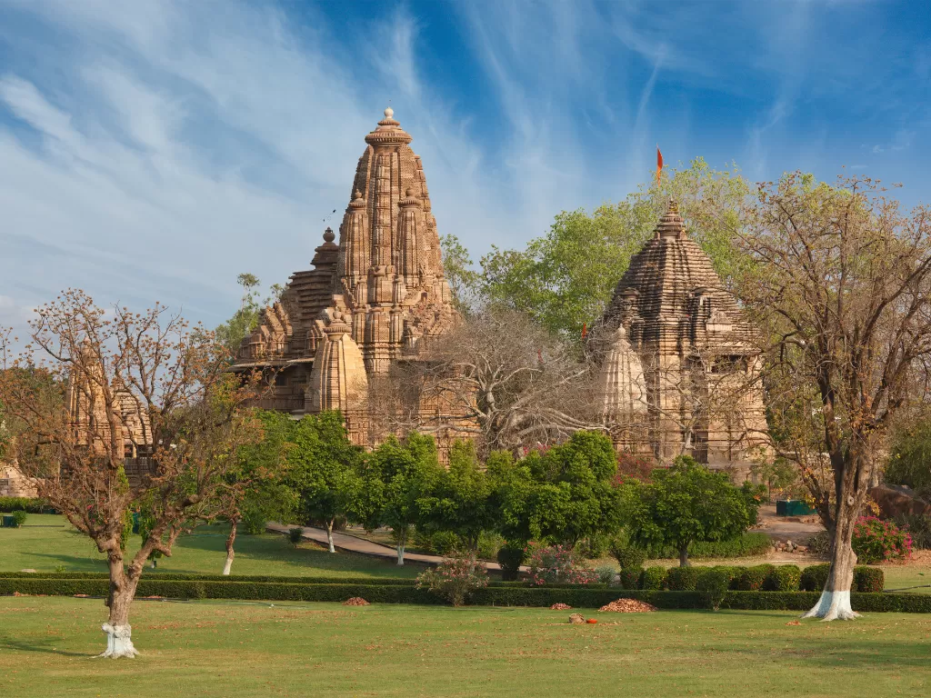 Matangeshwar Temple Khajuraho with nearby Western Group temples, active Shiva lingam worship Chandela era plain shikhara architecture landscaped gardens, perfect Madhya Pradesh UNESCO heritage tour package.