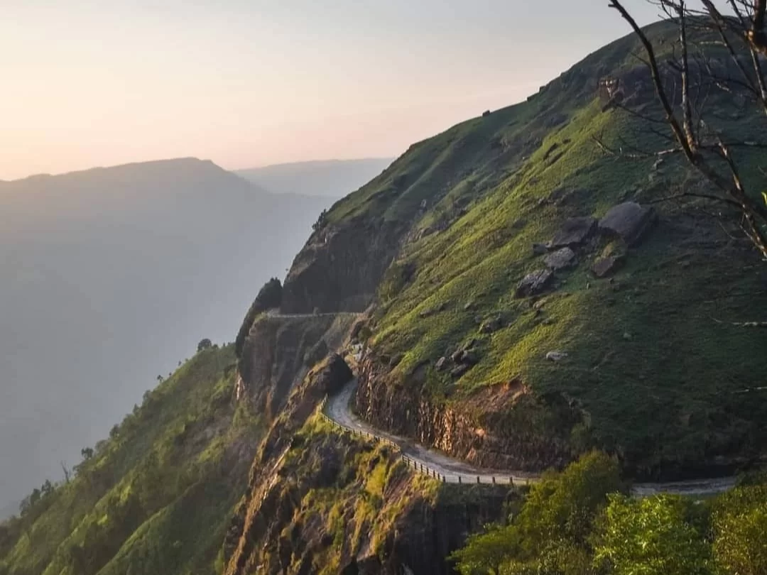 Mawsynram Hill Meghalaya scenic mountain road with lush green cliffs and panoramic valley views