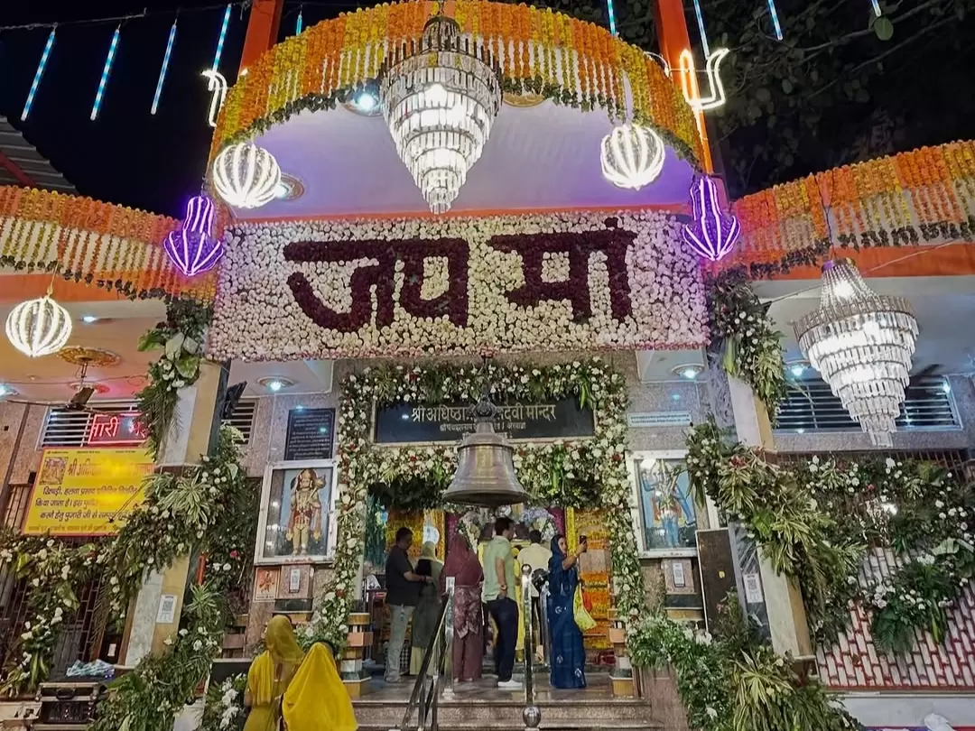 Maya Devi Temple Haridwar ancient Shakti Peeth adorned with flowers and vibrant evening decorations