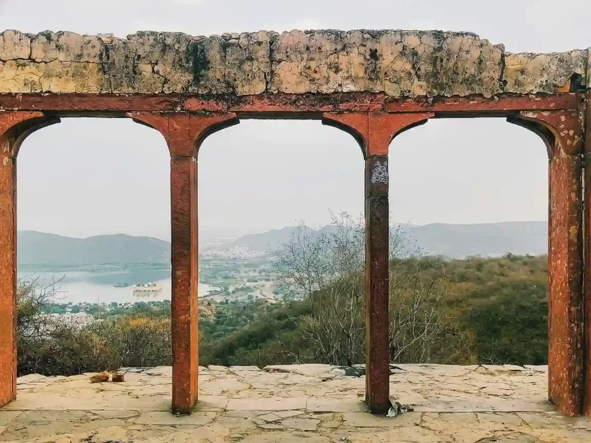 Medieval Ruins Chittorgarh Ancient crumbling stone structures and historic arches inside the massive Mewar hilltop fort Rajasthan.