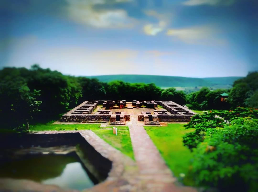 Monastery 51 at Sanchi in Madhya Pradesh featuring ancient brick ruins surrounded by greenery, included in Madhya Pradesh tour packages