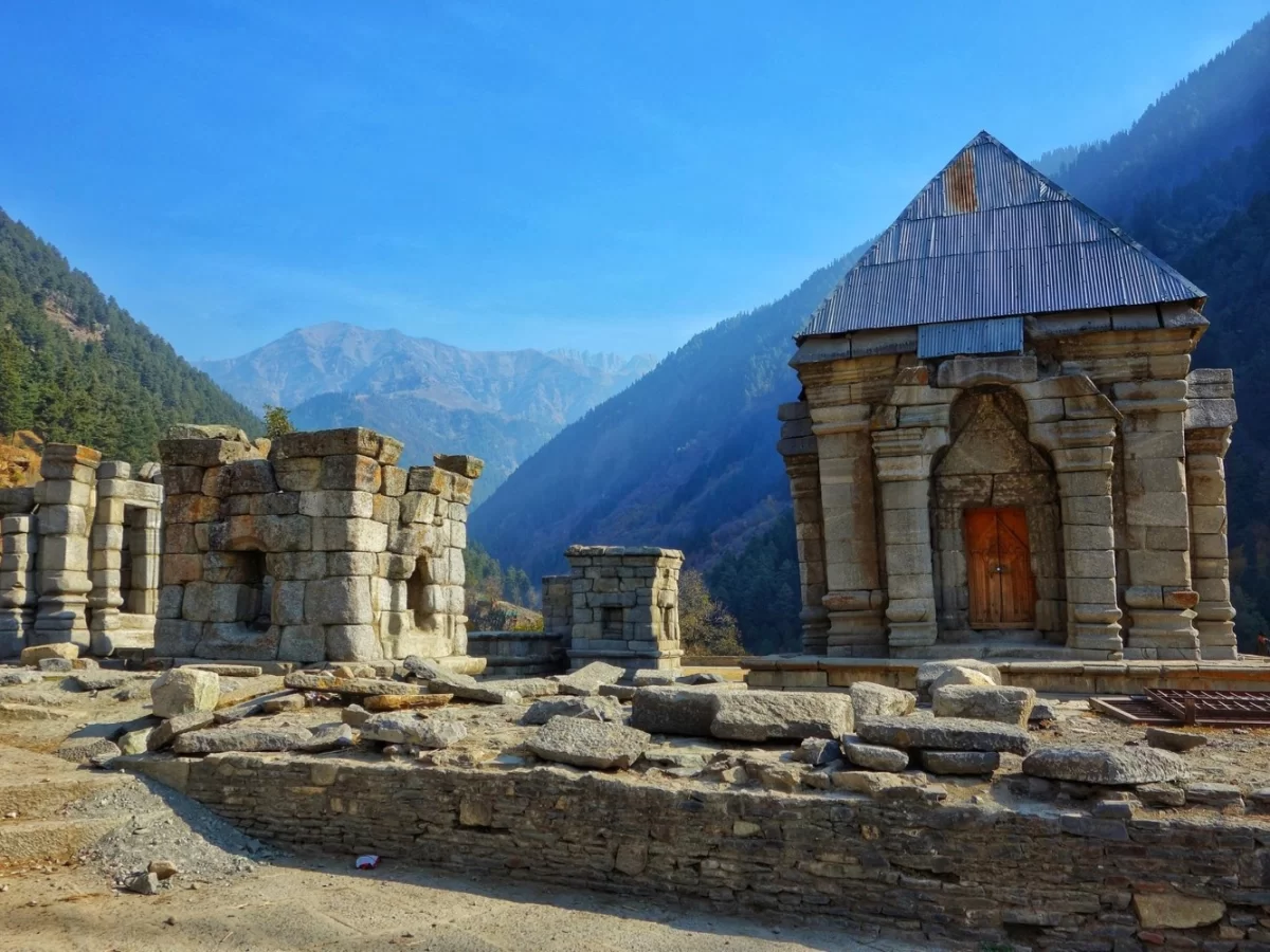 Narang Mandir Wangath ancient stone temple ruins surrounded by pine forests and Himalayan mountains in Ganderbal Kashmir