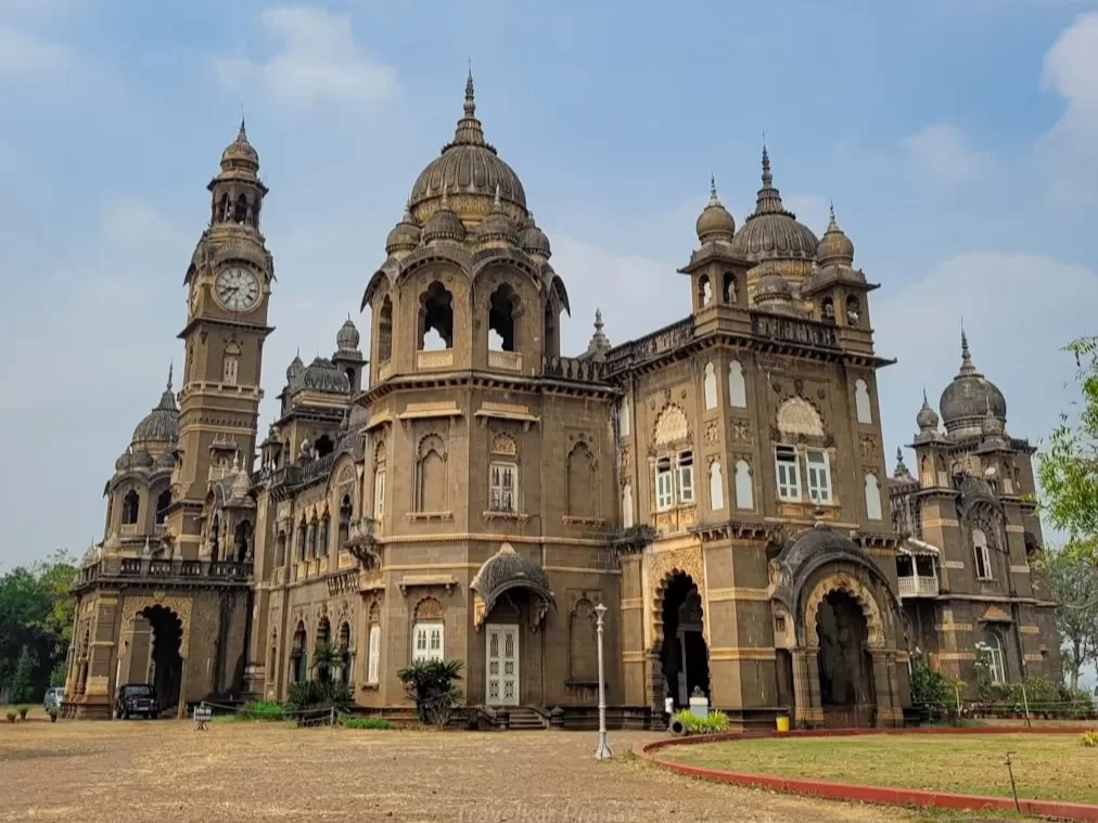 New Palace in Kolhapur, Maharashtra, showcasing Indo-Saracenic architecture with domes, arches, and a clock tower, a historic landmark included in Maharashtra tour packages.