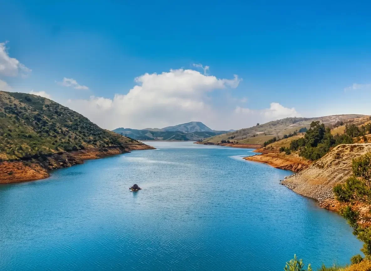 Ooty Lake scenic man-made lake with pedal boats and lush eucalyptus trees in the Nilgiri Mountains