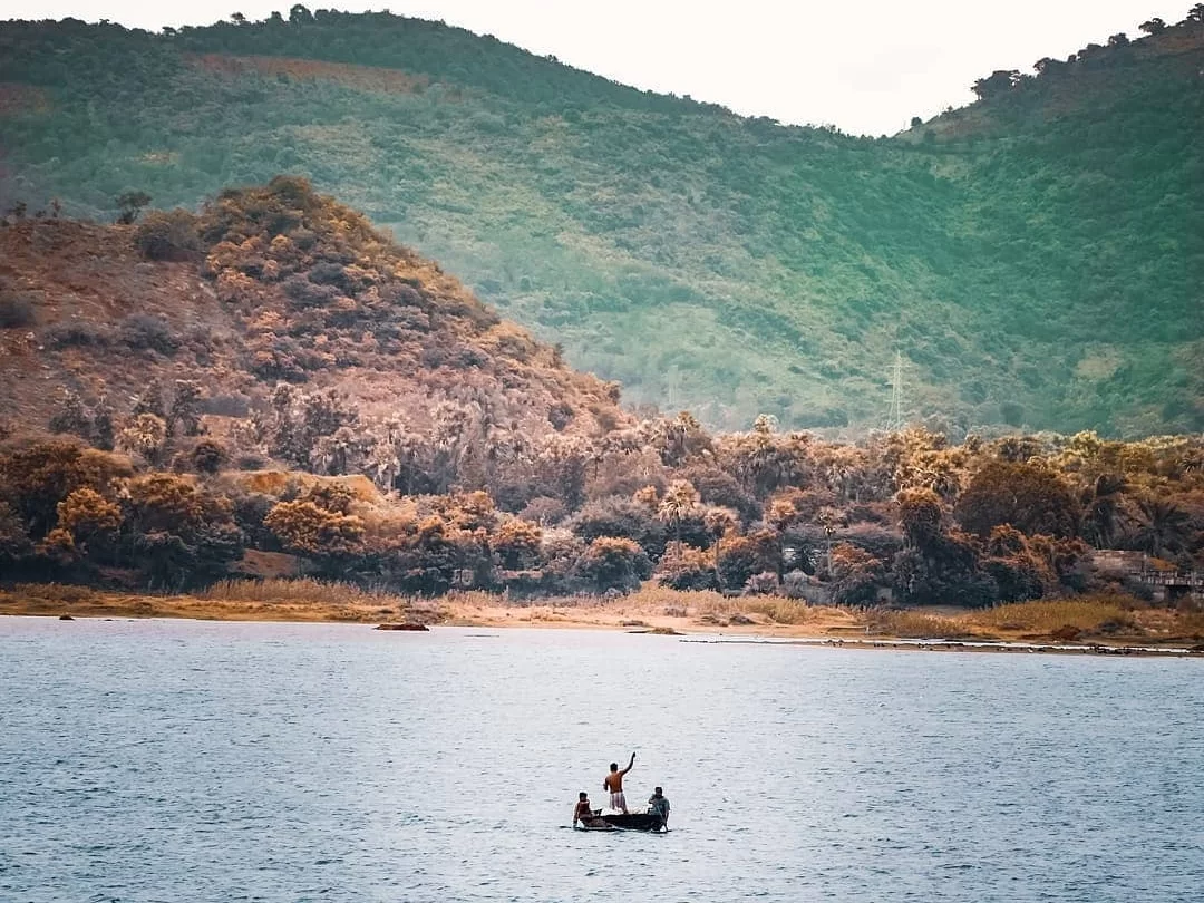 Pampa River Annavaram serene river view with hills in Andhra Pradesh tour packages.