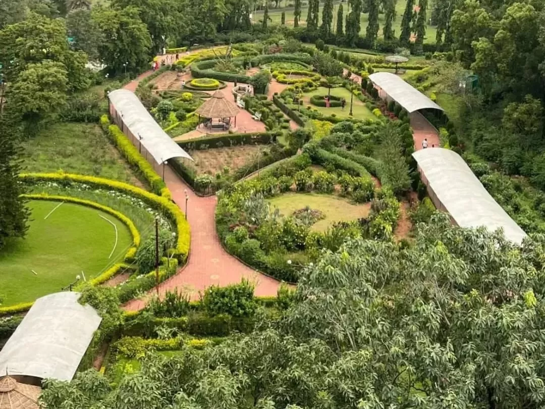 Pandav Caves in Pachmarhi with landscaped gardens and ancient rock-cut caves, Madhya Pradesh heritage tourism attraction