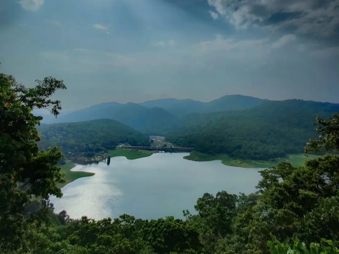 Peringalkuthu Dam, Thrissur Kerala scenic reservoir view surrounded by lush Western Ghats hills