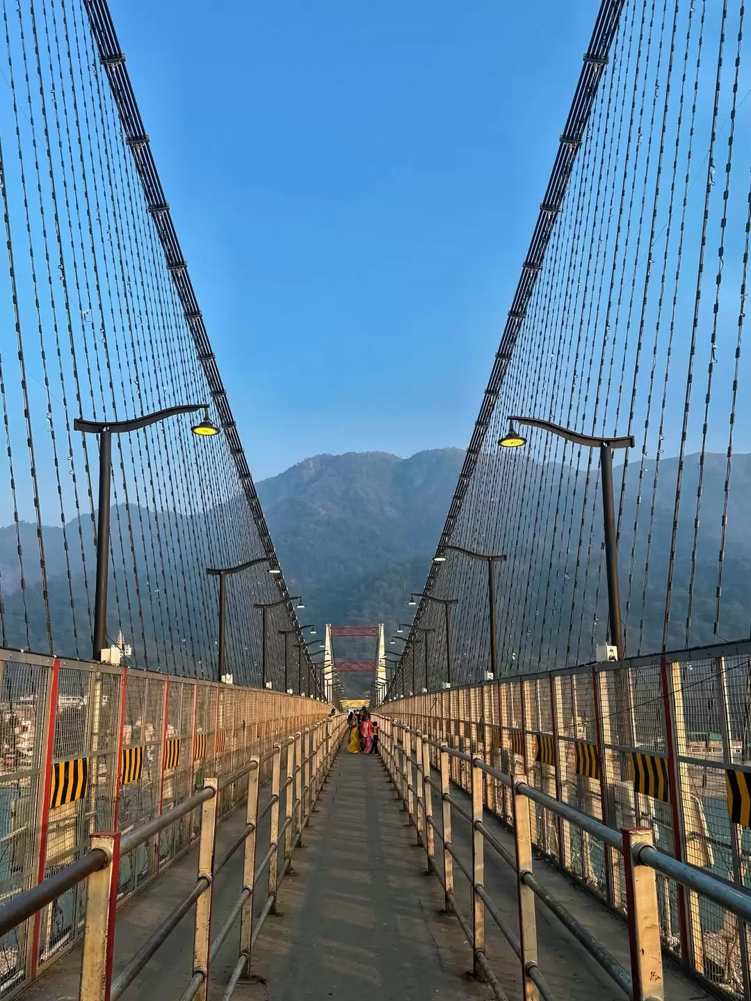 Lakshman Jhula, Rishikesh – iconic suspension bridge over Ganga featured in Uttarakhand tour packages