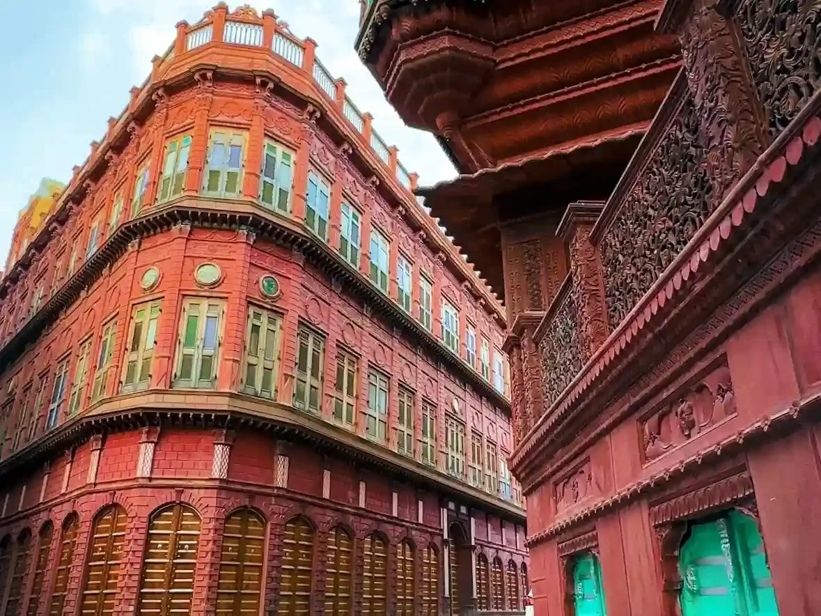 Rampuriya Haveli Bikaner Ornate red sandstone mansion featuring intricate jharokhas wood carvings and grand Victorian-era architecture Rajasthan.