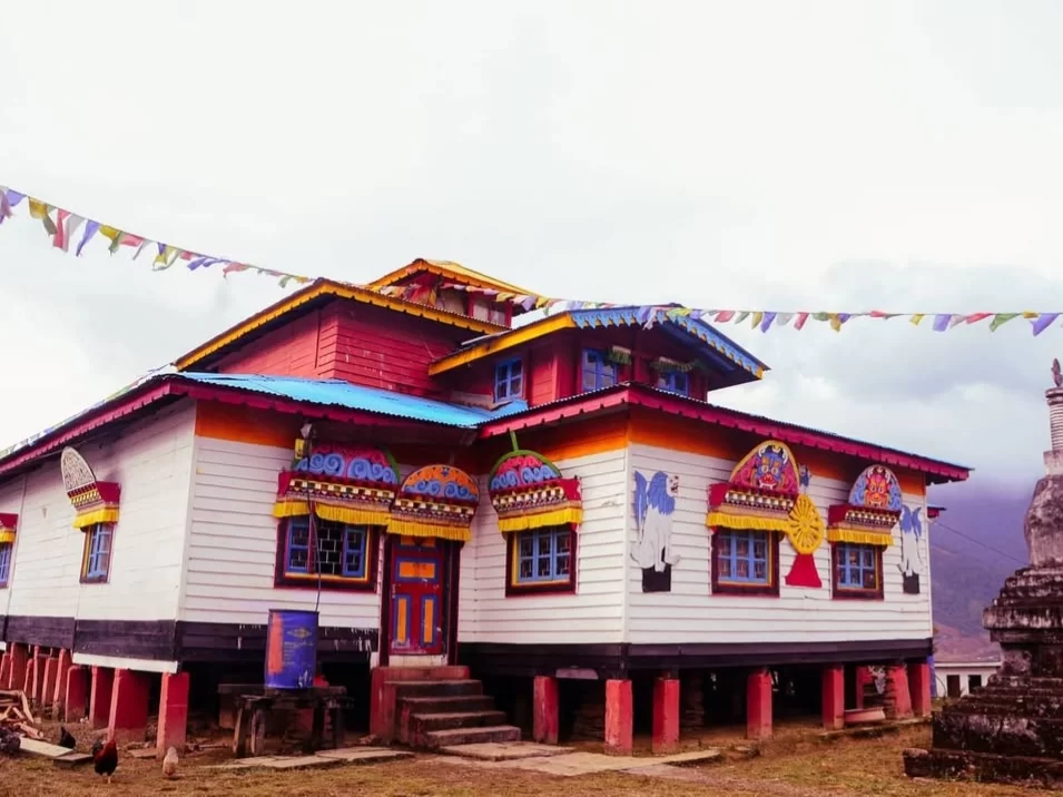 Samten Yongcha Monastery colorful traditional Buddhist monastery with vibrant murals and prayer flags in Arunachal Pradesh Tour Package.