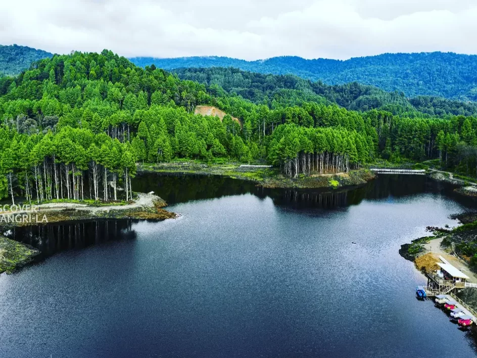 Seeh Lake serene mountain lake surrounded by dense green forests and tranquil natural beauty in Arunachal Pradesh Tour Package.