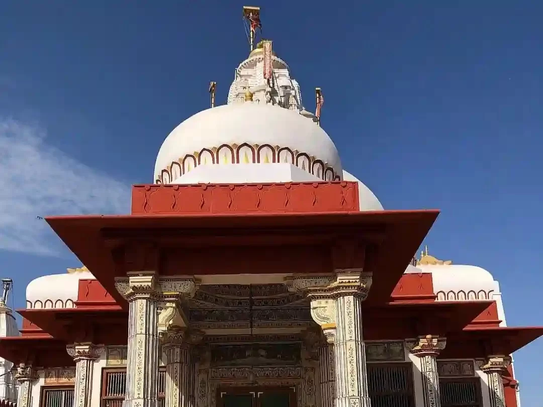 Seth Bhandashah Jain Temple Bikaner Ornate three-story 15th-century white marble and red sandstone shrine featuring vibrant gold-leaf murals and mirror work Rajasthan.
