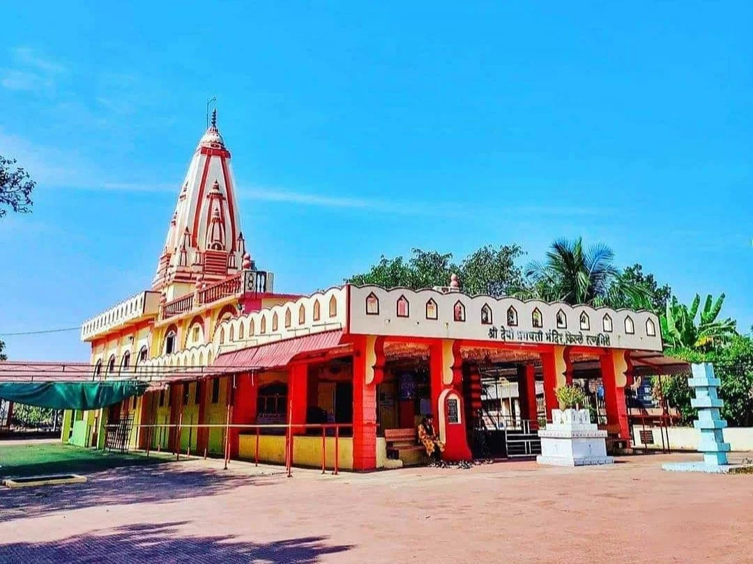 Shree Devi Bhagavati Temple in Maharashtra featuring the colorful temple structure with tall spire and open courtyard, a revered religious site included in Maharashtra tour packages