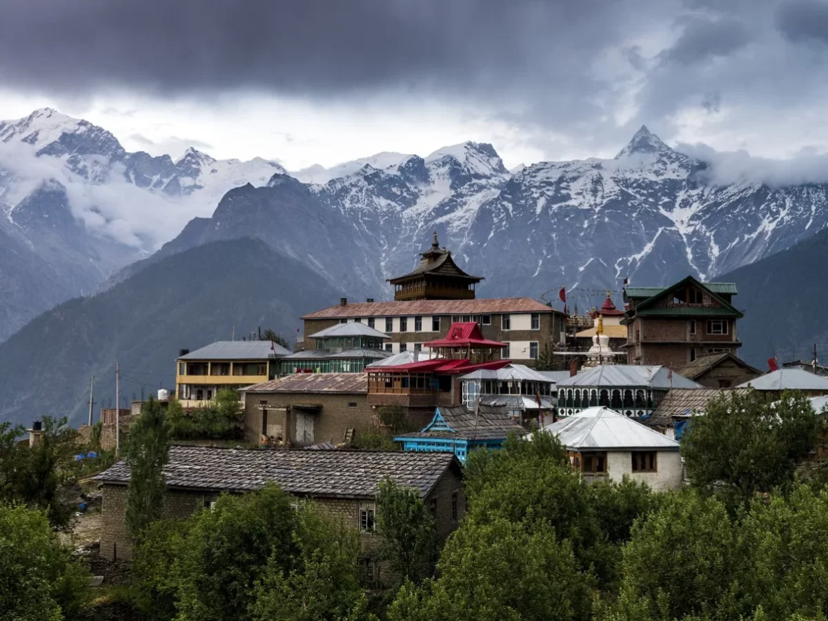 Shree Narayan Nagin Devi Ji Mandir at Kalpa during overcast skies, featuring temple complex Kinnaur Kailash peaks trees, perfect cultural experience Kinnaur Himachal tour package.