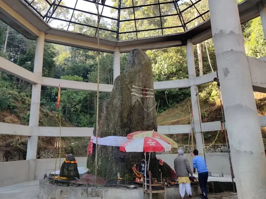 Shree Siddheshwar Nath Temple sacred shrine featuring a towering Shiva lingam surrounded by serene greenery in Arunachal Pradesh Tour Package.