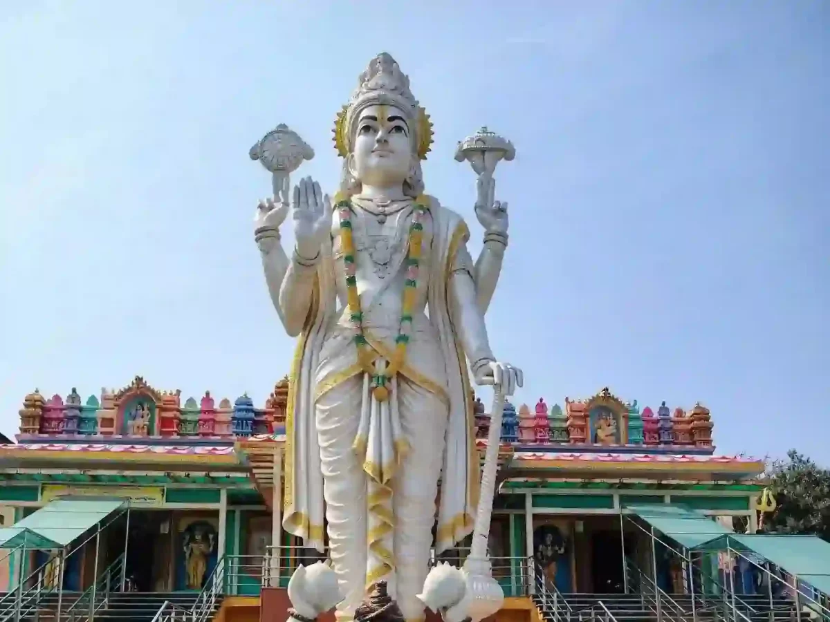 Shri Naimishnath Vishnu Temple Naimisharanya, sacred Hindu temple featuring towering Lord Vishnu statue and vibrant spiritual ambiance in Uttar Pradesh.