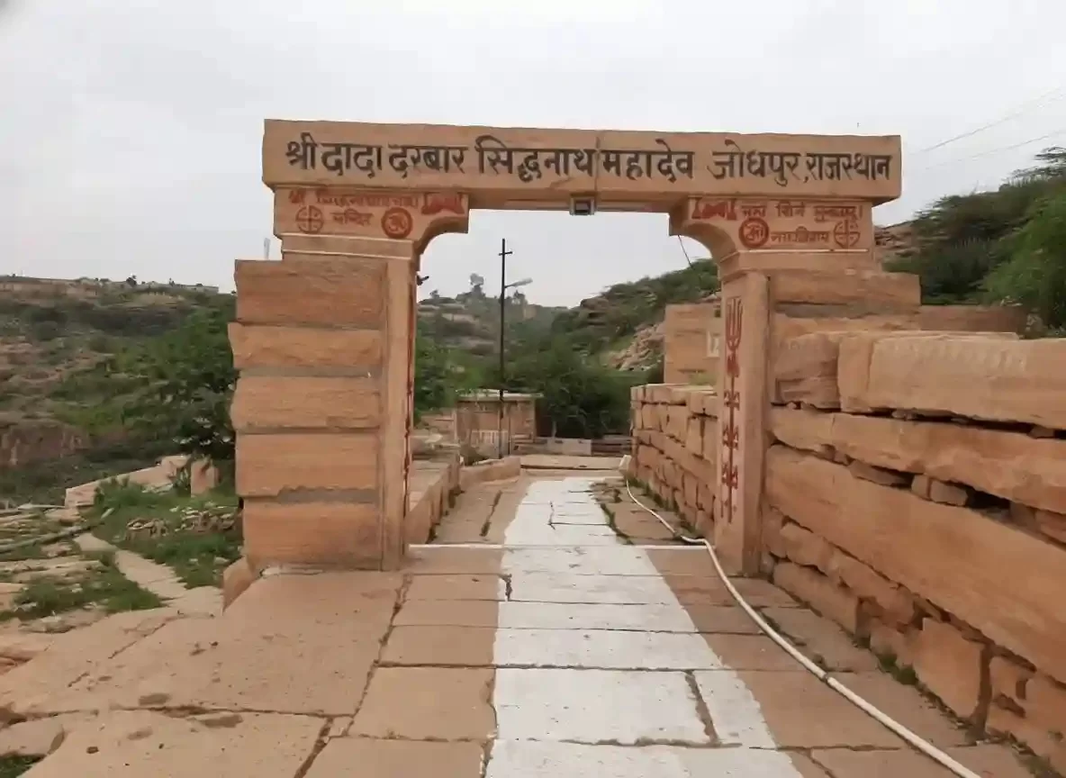 Siddhanath Mahadev Temple Jodhpur Traditional 15th-century stone shrine dedicated to Lord Shiva featuring a natural rock-cut cave and a peaceful lakeside setting Rajasthan.