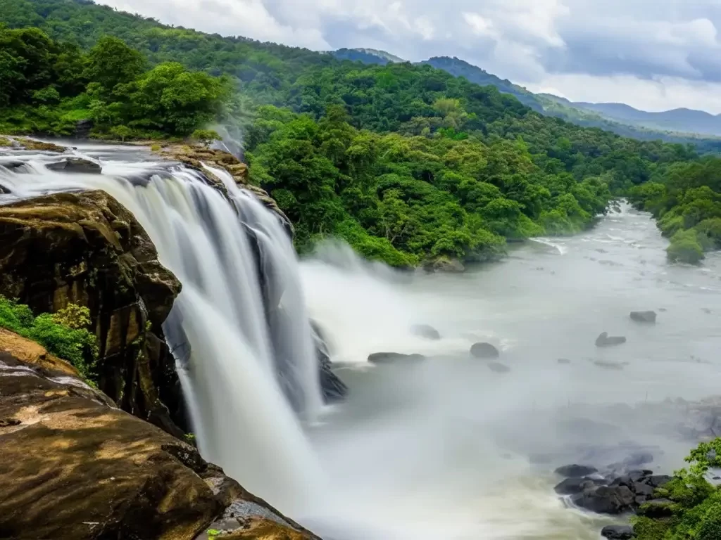 Siruvani Waterfall scenic cascades of white water surrounded by dense green forests and the Siruvani reservoir in Coimbatore.