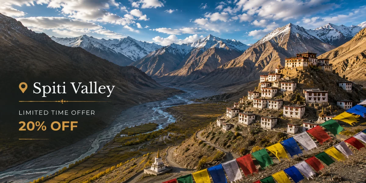 Spiti Valley mountain landscape featuring ancient hilltop monastery, winding river valley, barren Himalayan mountains, colorful prayer flags, and rugged high-altitude scenery.