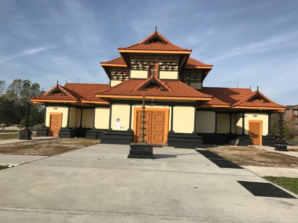 Sree Guruvayurappan Temple in Guruvayur during daylight, featuring traditional Kerala temple architecture and intricate wooden carvings, perfect spiritual experience, Kerala tour packages.