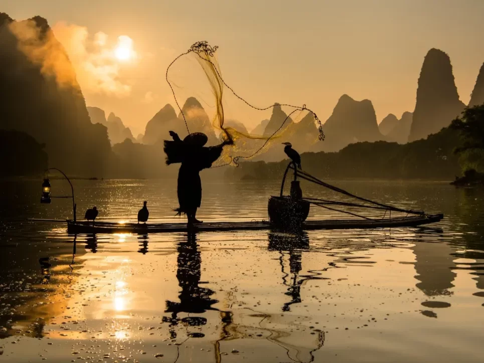 Tarin Fish Ponds scenic water body reflecting golden sunset hues with tranquil surroundings in Arunachal Pradesh Tour Package.