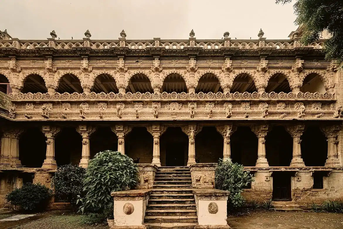 Navlakha Palace in Gondal featuring exquisite stone carvings, ornate arches, and a grand heritage architecture, perfect Gujarat tour package experience.