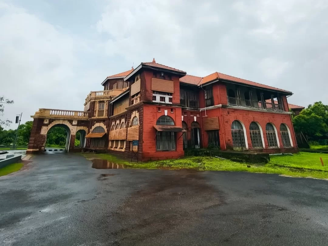 Thiba Palace in Ratnagiri, Maharashtra, a historic red-brick royal residence with arched windows and tiled roofs, a heritage attraction included in Maharashtra tour packages.