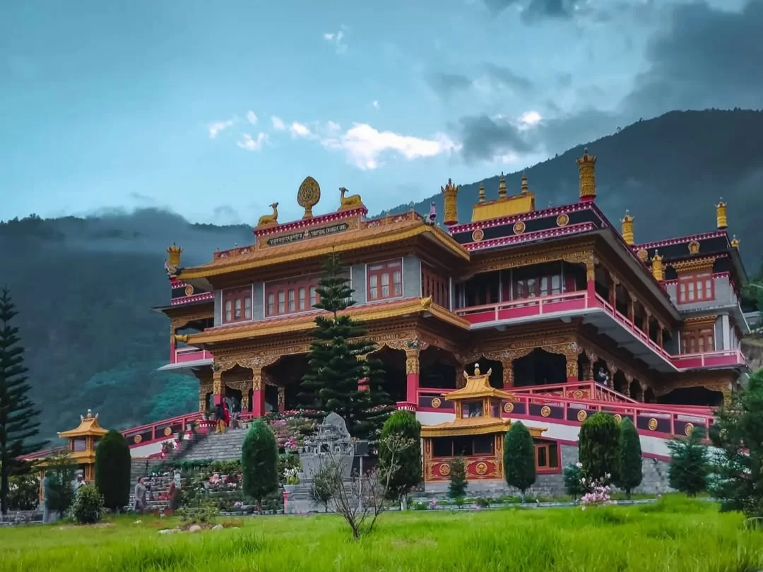 Thupsung Dhargye Ling Buddhist Monastery magnificent Tibetan-style temple set against serene mountain scenery in Arunachal Pradesh Tour Package.