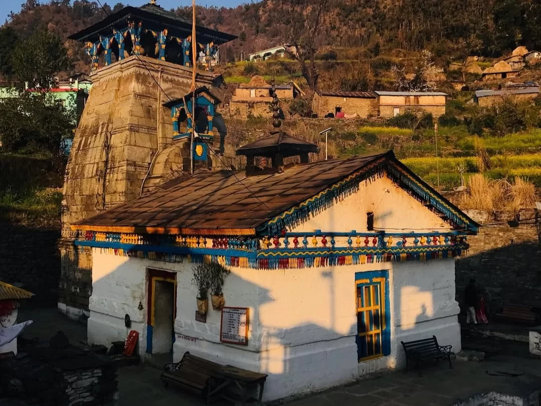 Triyuginarayan Temple near Guptkashi, Uttarakhand showcasing traditional Himalayan architecture against a scenic village backdrop, a sacred wedding site of Lord Shiva and Parvati included in Uttarakhand tour packages