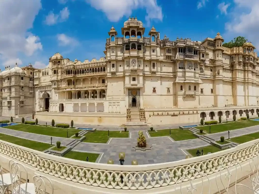 Udaipur City Palace Museum Majestic 16th-century lakeside complex featuring ornate peacock mosaics, mirrored galleries, royal silver collections, and panoramic views of Lake Pichola Rajasthan.