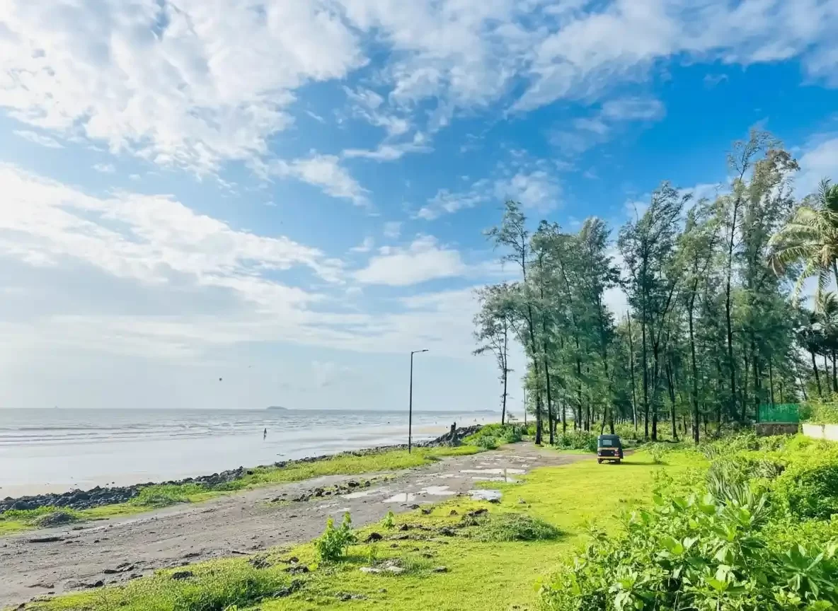 Varsholi Beach peaceful coastal stretch with lush greenery in Alibaug Maharashtra tour packages