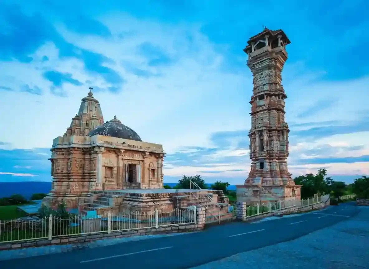 Vijay Stambha Chittorgarh Majestic 15th-century "Tower of Victory" standing nine stories tall, adorned with intricate sculptures of Hindu deities and scenes from the Ramayana and Mahabharata Rajasthan.