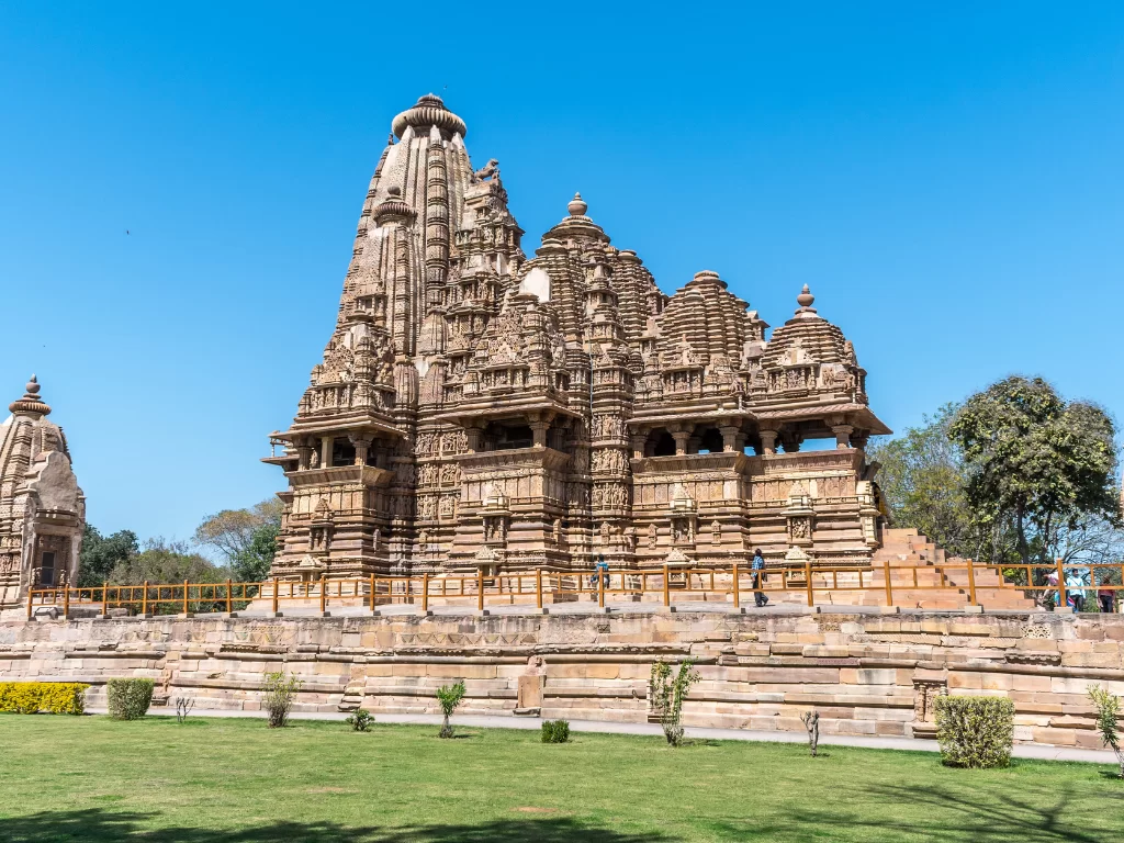 Vishwanath Temple Khajuraho Madhya Pradesh UNESCO site, intricate Nagara-style sandstone shikhara carvings dedicated Shiva Nandi shrine, ideal Indian heritage temple tour package.