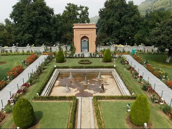 Chashme Shahi Srinagar aerial view Mughal pavilion central fountain terraced flower beds chinar trees Zabarwan backdrop featured in Kashmir tour packages