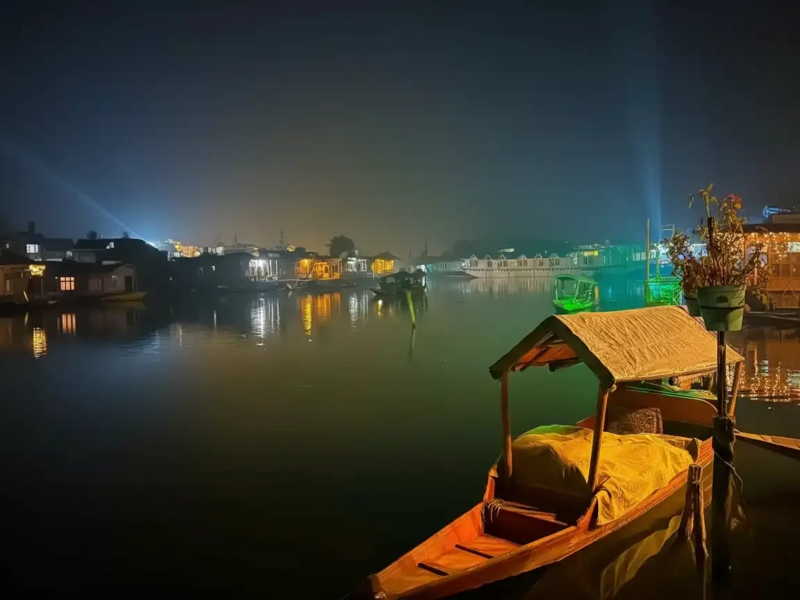 Shikara boat night lights houseboats Dal Lake Srinagar colorful reflections featured in Kashmir Srinagar tour packages