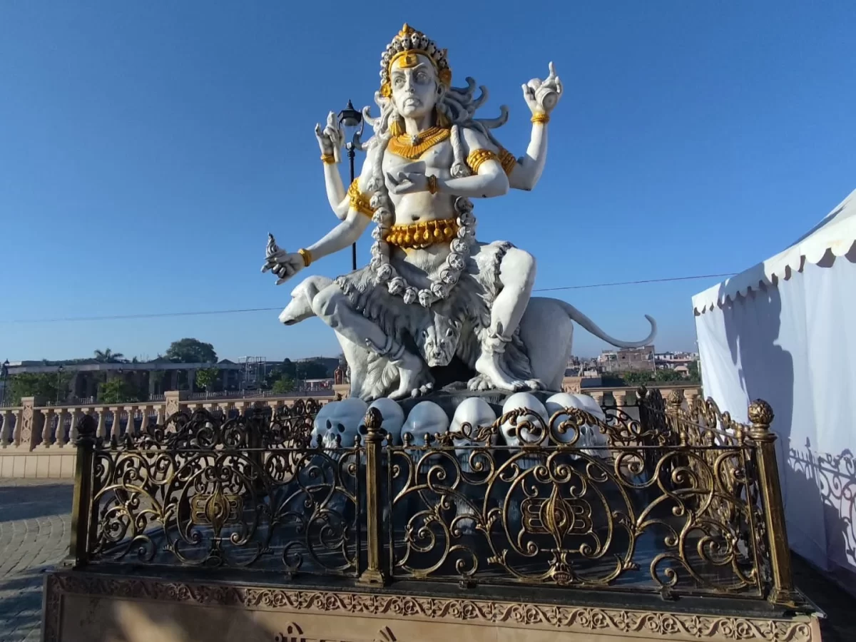 White Ardhanarishvara statue at Mahakal Lok Corridor Ujjain during clear daylight, featuring multiple arms lion mount, perfect spiritual Madhya Pradesh tour package.