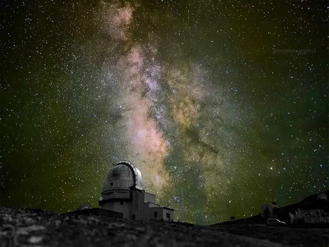 Hanle Indian Astronomical Observatory dome Milky Way colorful cosmic trails rugged terrain, Chandra 2m telescope high-altitude stargazing, perfect dark sky astrophotography package.