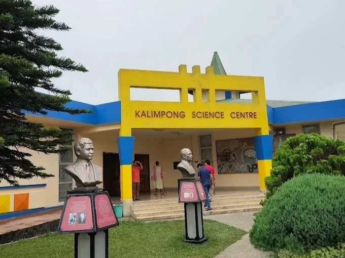 Kalimpong Science Centre in Kalimpong, West Bengal, featuring its colorful entrance with educational exhibits and statues at the front lawn, a family-friendly attraction included in West Bengal tour packages.