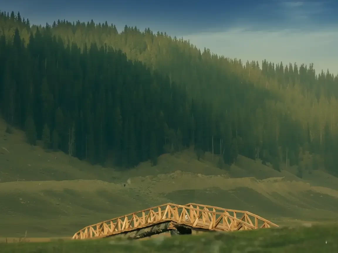 Wooden truss bridge at Lolab Bungus Valley during partly cloudy sunset, featuring pine forests green hills meadows, perfect adventure experience Kashmir tour packages.