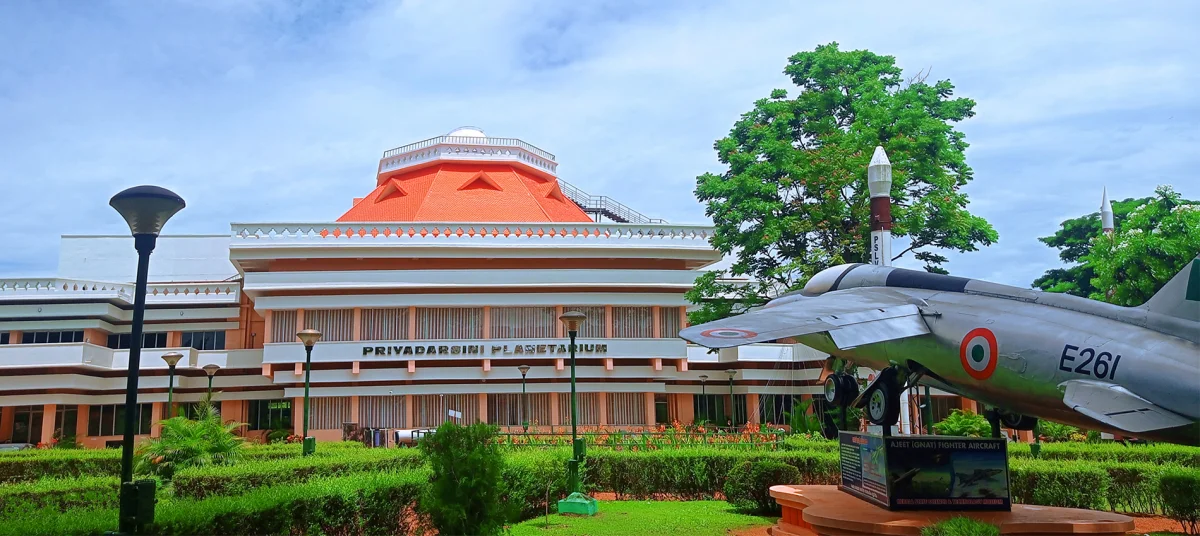 Space Museum in Thiruvananthapuram during daylight, featuring aerospace exhibits and museum building, perfect family experience, Kerala tour packages.