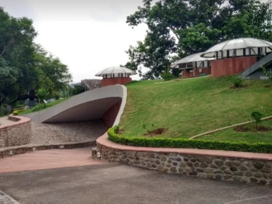 Nature Interpretation Centre in Kalimpong, West Bengal, featuring landscaped pathways, green lawns, and eco-friendly structures set amid forested surroundings, a key attraction included in West Bengal tour packages.
