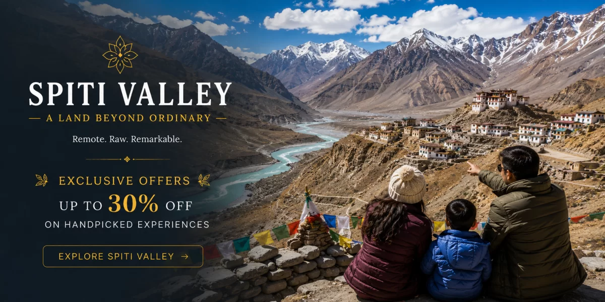 Family enjoying dramatic Spiti Valley landscape with winding turquoise river, rugged Himalayan mountains, remote monastery villages, and colorful prayer flags during a scenic high-altitude journey in Himachal Pradesh.