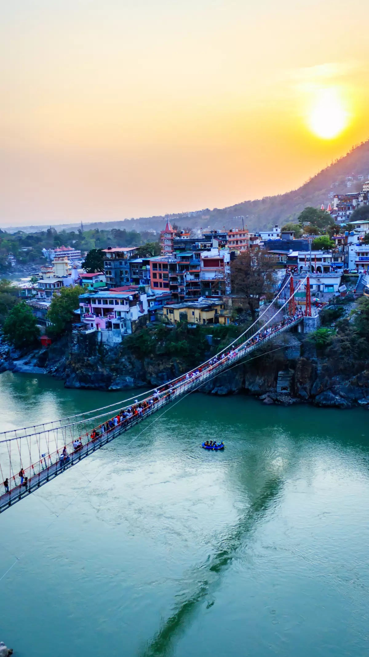 Lakshman Jhula, Rishikesh – sunset view over Ganga River featured in Uttarakhand tour packages