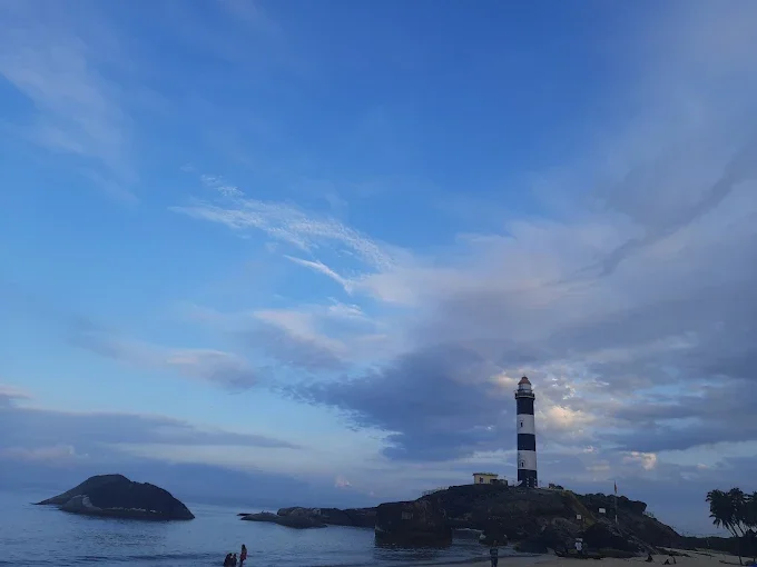 Kaup Beach in Udupi during sunset, featuring iconic lighthouse, Arabian Sea and rocky shoreline, perfect beach experience, Karnataka tour packages.