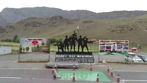 Drass Kargil War Memorial Ladakh soldier statues Indian tricolor flag banners mountains highway cars cones, honoring 1999 Operation Vijay heroes on Srinagar-Leh NH1D, perfect Ladakh adventure package